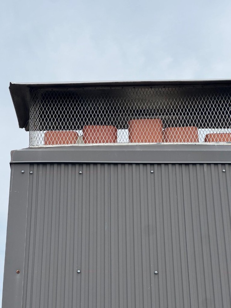 New chimney cap and screen installed