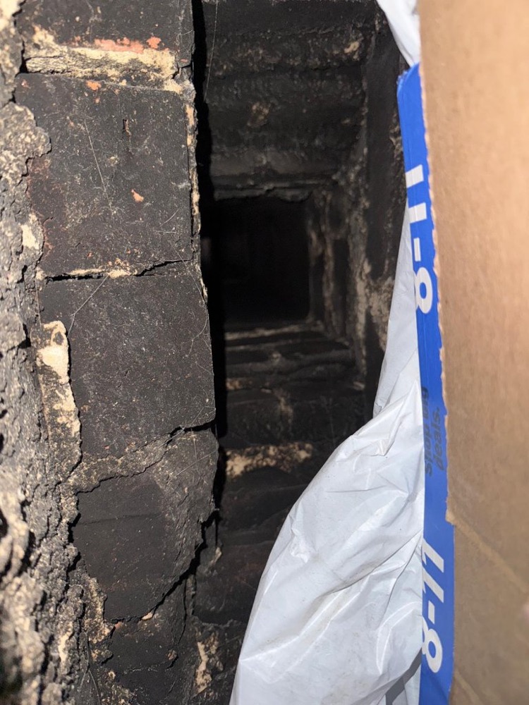 Heavy creosote buildup inside chimney flue