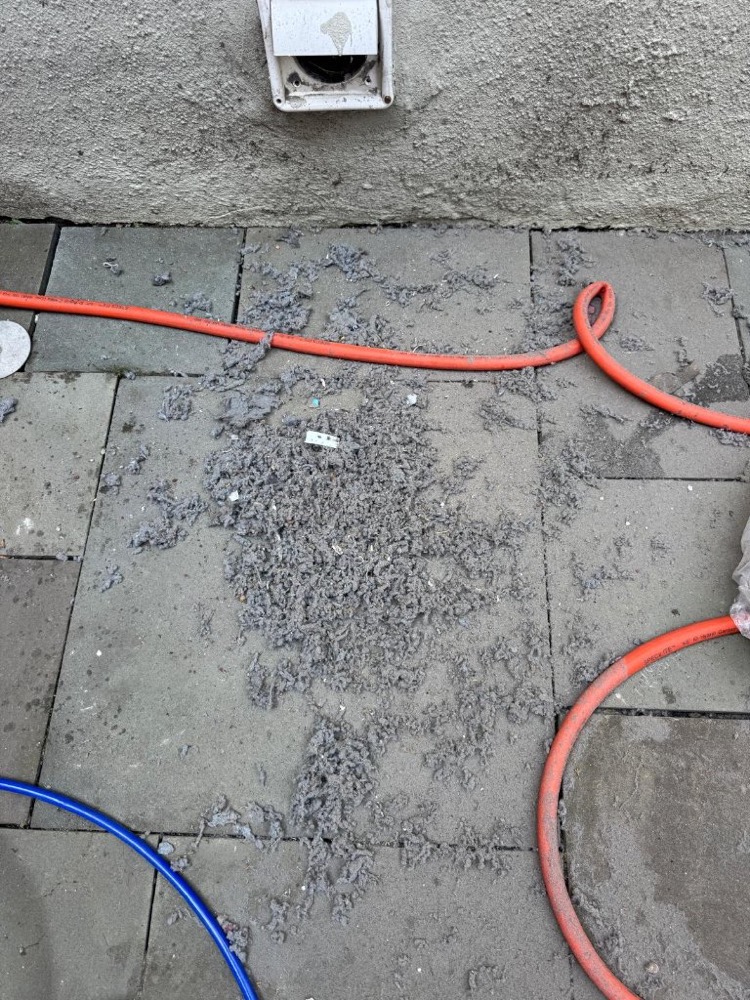 Handful of lint removed from a clogged dryer vent